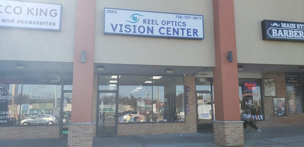 Reel Optics Vision Center storefront with blue-and-white sign on County Road 516, Old Bridge