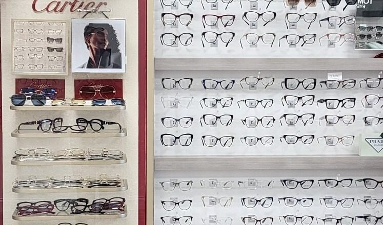 Prada Eyewear and Cartier frame displays in the Reel Optics showroom