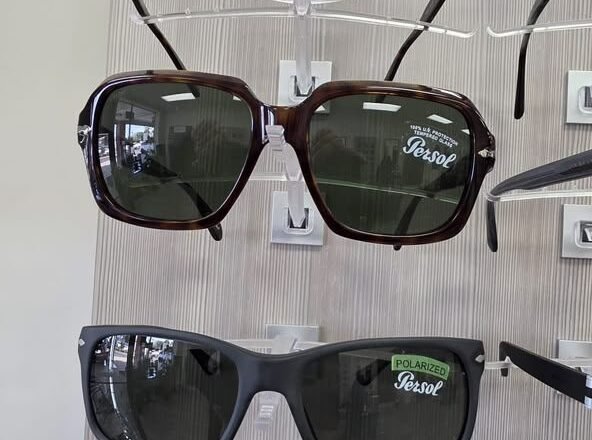 Persol sunglasses on a display rack